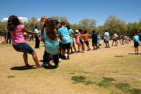 Children compete in a tug-of-war contest.